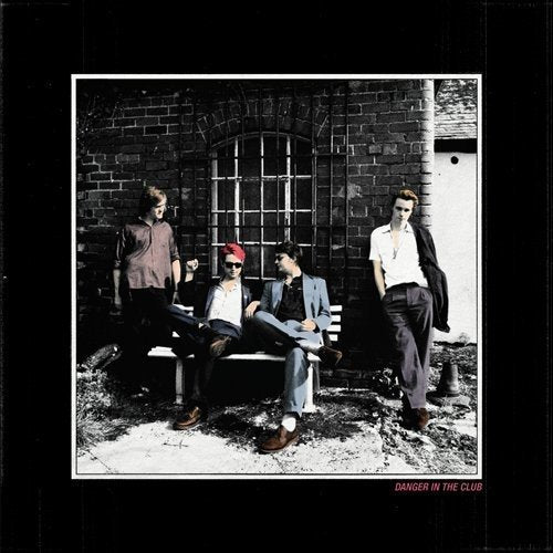 Palma Violets album cover: four men posing by a brick building.