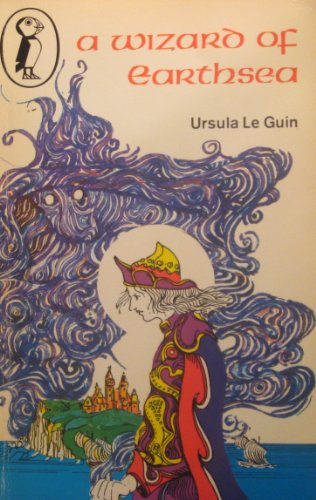 "A Wizard of Earthsea" book cover with dark blue landscape and flying figure illustration.