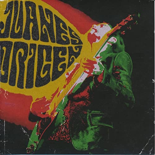 CD cover for Juanes’ “Origen” featuring a guitarist in vibrant colors.