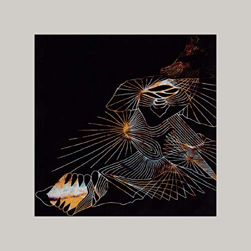The image depicts a vinyl record cover with a black background and a white, orange, and red abstract design. Alt text: "Black vinyl record cover with abstract white, orange, and red design."