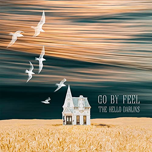 CD cover: small house, flying birds, and golden, blurred landscape.