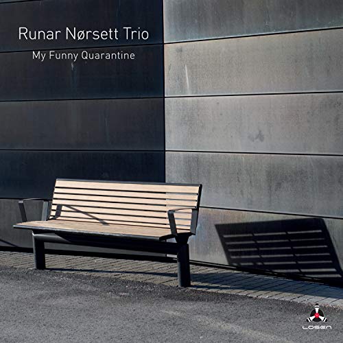 CD cover: park bench in front of a textured grey building.