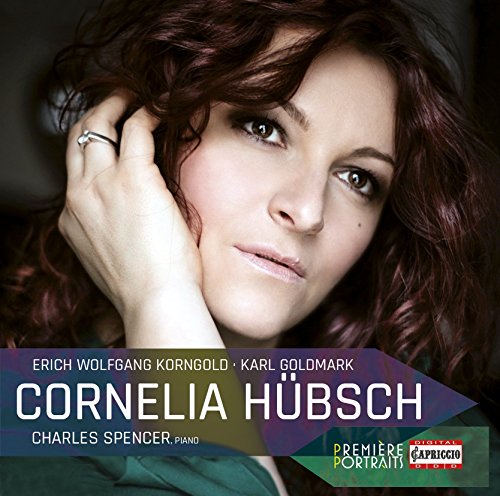 A woman with curly red hair and a green top on a CD cover.