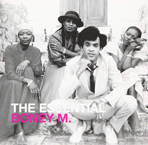 Black and white photo of Boney M. band members posing together.