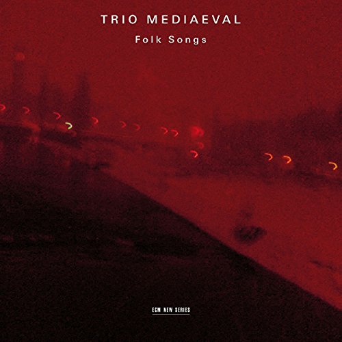 Red-toned album cover with white text, blurry background, and glowing red lights.