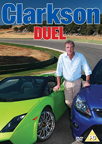 "Man standing between a green and blue sports car on a racetrack."