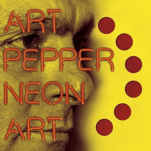 Yellow album cover with close-up of man's face and red text and dots.