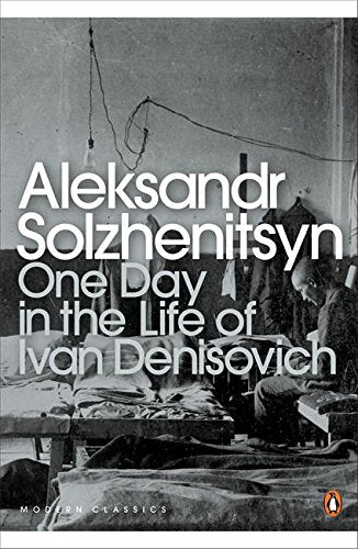 "Book cover with black-and-white image of a man in a sparse, dimly lit room."