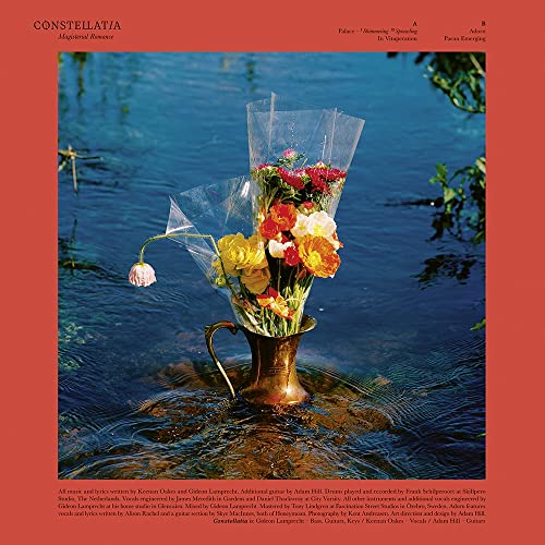 CD cover: bouquet in a brass pot, set in shallow water.