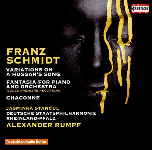 "CD cover with a black background, close-up face, and yellow streaks."