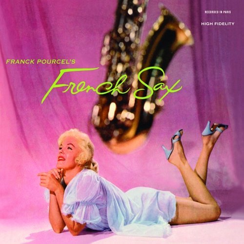 A blonde woman in a light blue dress poses before a large golden saxophone.