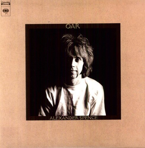 "Album cover with a man in a white shirt against a black background."