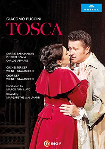 DVD cover for Puccini’s *Tosca* opera, featuring two singers embracing.