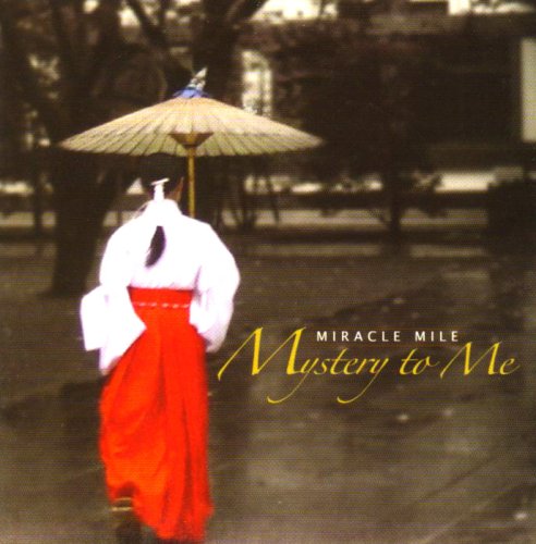 "Album cover featuring a person in red dress with a parasol."