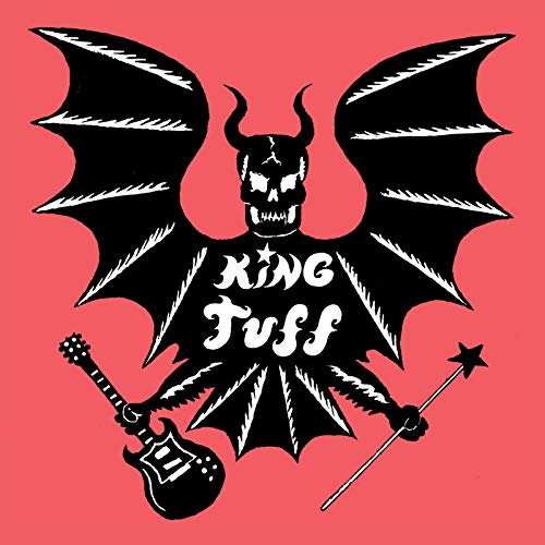 Black devil figure with guitar and wand on red background.