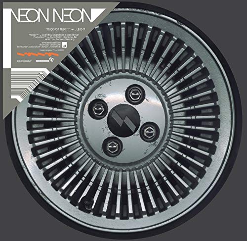 Vinyl record with a gray and black circular design on a dark gray background.