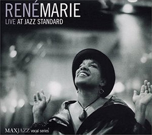 Black and white CD cover with a woman singing, wearing a hat.