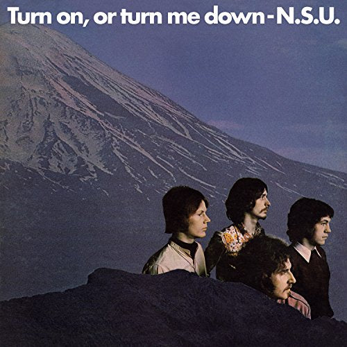 Vinyl album cover with four men in front of a large mountain.