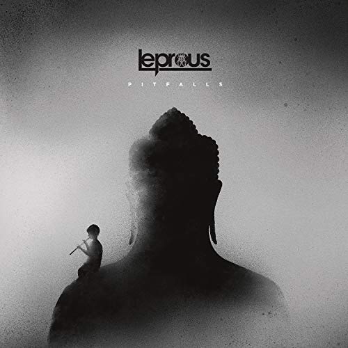 "Album cover featuring a black silhouette of a head with a small figure."