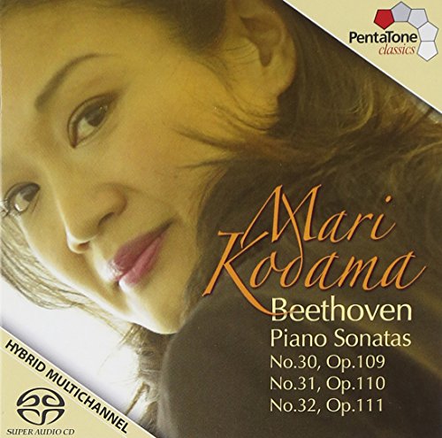 Mari Kodama's face on a CD cover with text and logos.