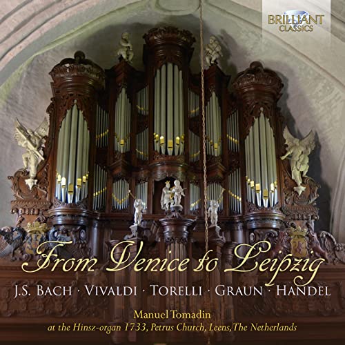 Ornate brown pipe organ with sculptures, album cover for classical music.
