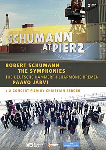 DVD cover featuring a conductor and musicians standing on a dock.