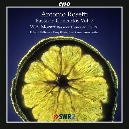 CD cover with a yellow flower on a dark blue background.