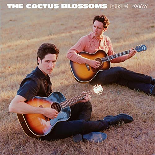 CD cover featuring two men with acoustic guitars in a field.