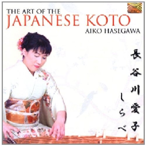 Woman in traditional kimono plays koto, with Japanese text and title on album cover.