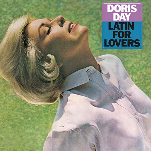 Doris Day album cover, close-up of woman looking upwards on green grass.