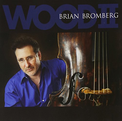 "Album cover with a man holding a double bass, titled 'Wood II' by Brian Bromberg."