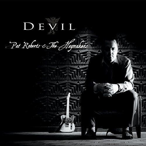 Black and white album cover featuring Pat Roberts with a guitar.