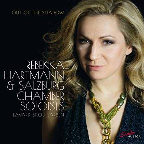 "CD cover featuring a blonde woman wearing a dark top and gold necklace."