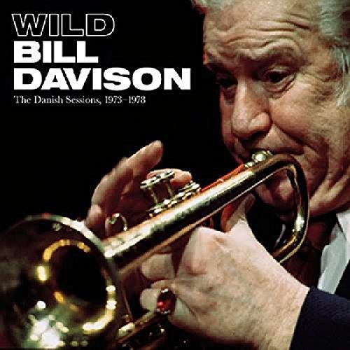 "Album cover featuring a close-up of an older man playing a trumpet."
