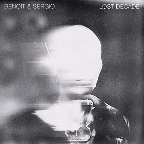 Black and white album cover featuring a distorted, faceless portrait.