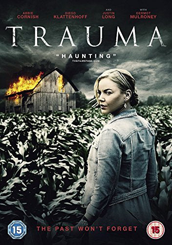 DVD cover for "Trauma" featuring a woman standing in a field with a burning barn.