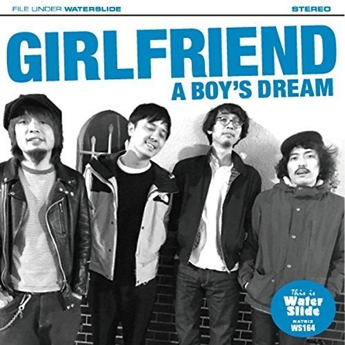 "CD cover featuring four men standing against a brick wall, with blue title text."