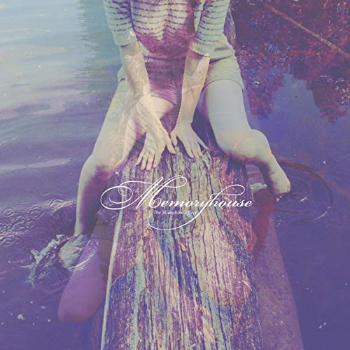 CD cover: person sitting on a log with faded imagery.