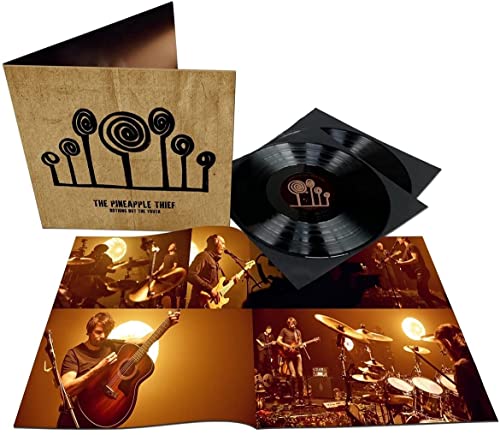 The Pineapple Thief vinyl set featuring a gatefold cover, black records, and concert photos.