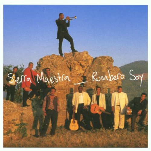 Album cover featuring a group of men with instruments on a rocky hillside.