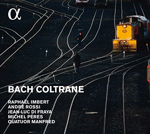 "Album cover with dark train yard scene and white text listing artists and title."