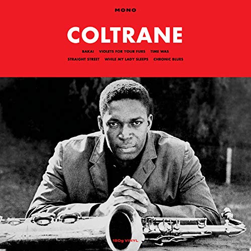 John Coltrane album cover, black and white portrait with saxophone.