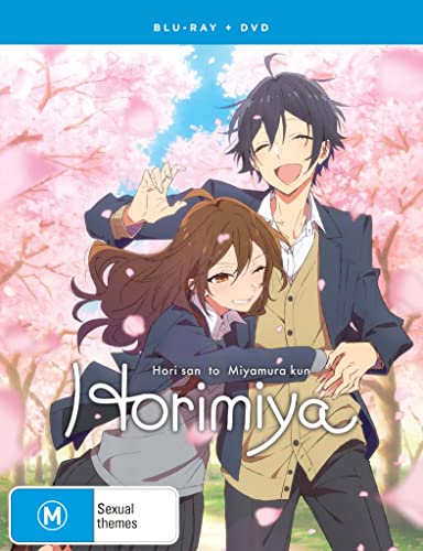 Anime cover featuring a smiling teenage couple embracing under blooming cherry blossom trees.