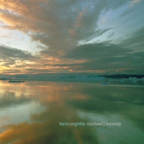 "CD cover with serene lake and cloudy sky at dusk, reflecting orange and blue hues."