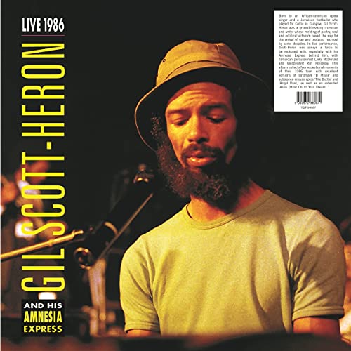Vinyl album cover featuring Gil Scott-Heron in a hat, performing live.