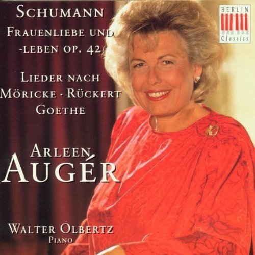 "CD cover featuring a woman in red dress with white text and logo."