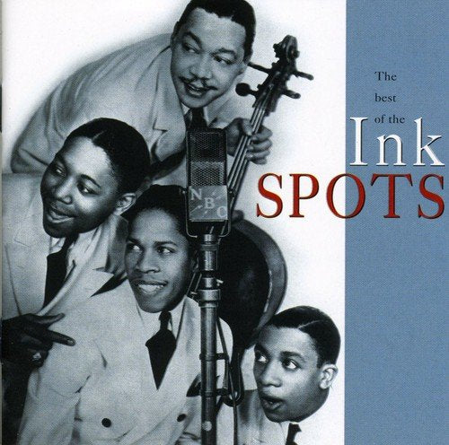 Black and white photo of The Ink Spots performing with a microphone.