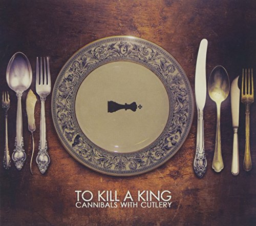"Album cover with ornate plate, cutlery, and a key on a wooden table."