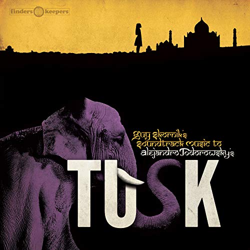 Album cover for “Tusk” featuring an elephant, Taj Mahal, and silhouetted figure.