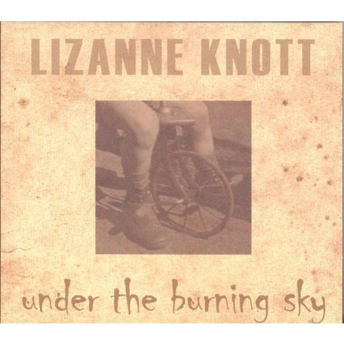 Album cover with sepia-toned image of a person's legs and a wheelchair.